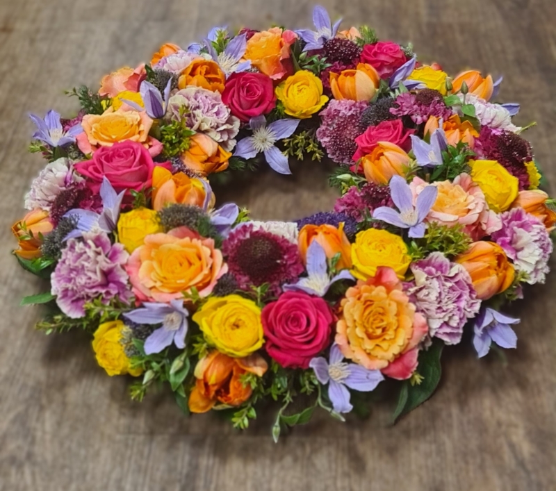 funeral wreaths reds orange